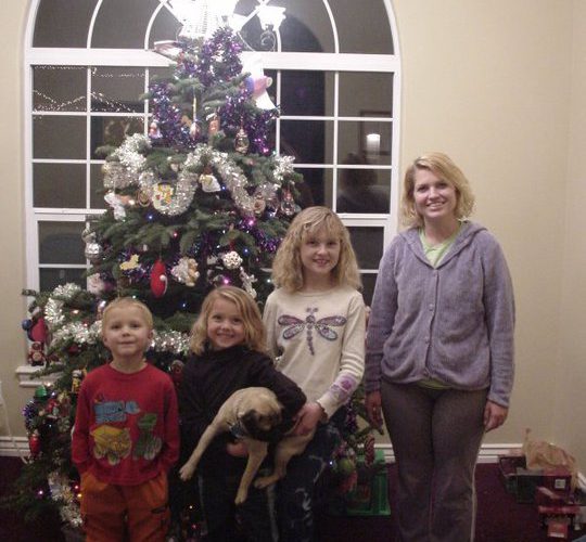 Photo of my mom, siblings and I at Christmas time